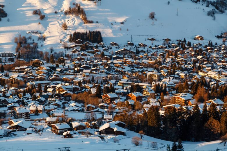 Snow-covered Megève village nestled in the French Alps at sunset
